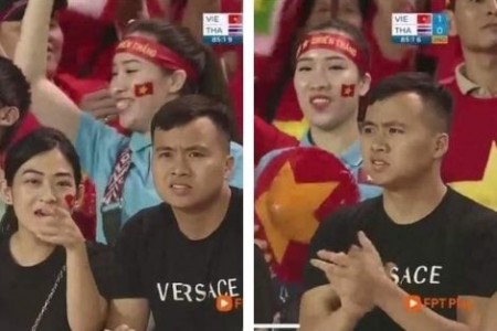 Hot: Người đàn ông dẫn “bồ” đi xem bóng đá được camera cho lên TV